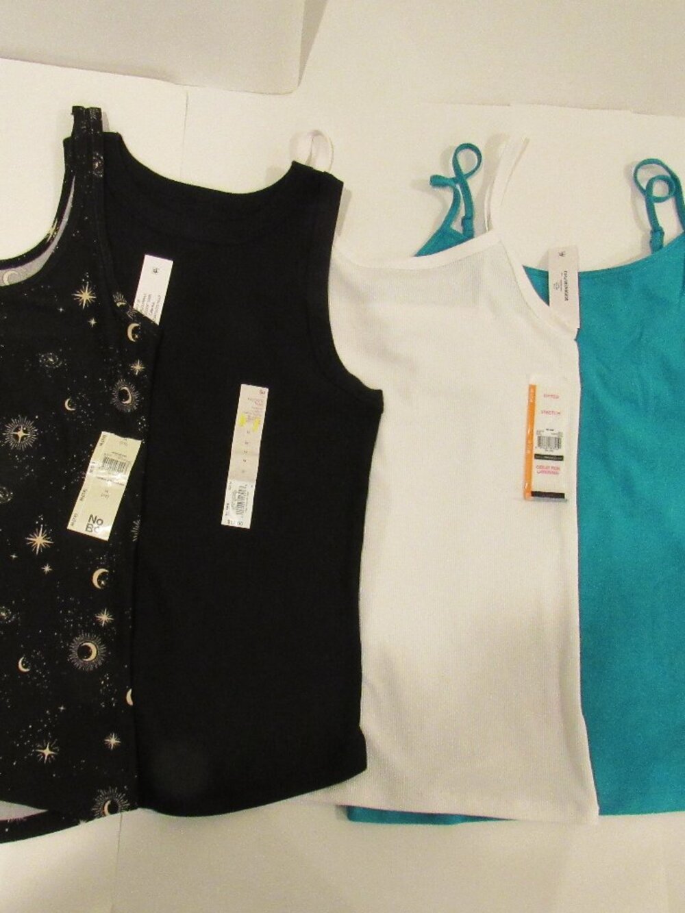 FOUR NEW JUNIORS/WOMENS TANK TOPS SIZE MEDIUM